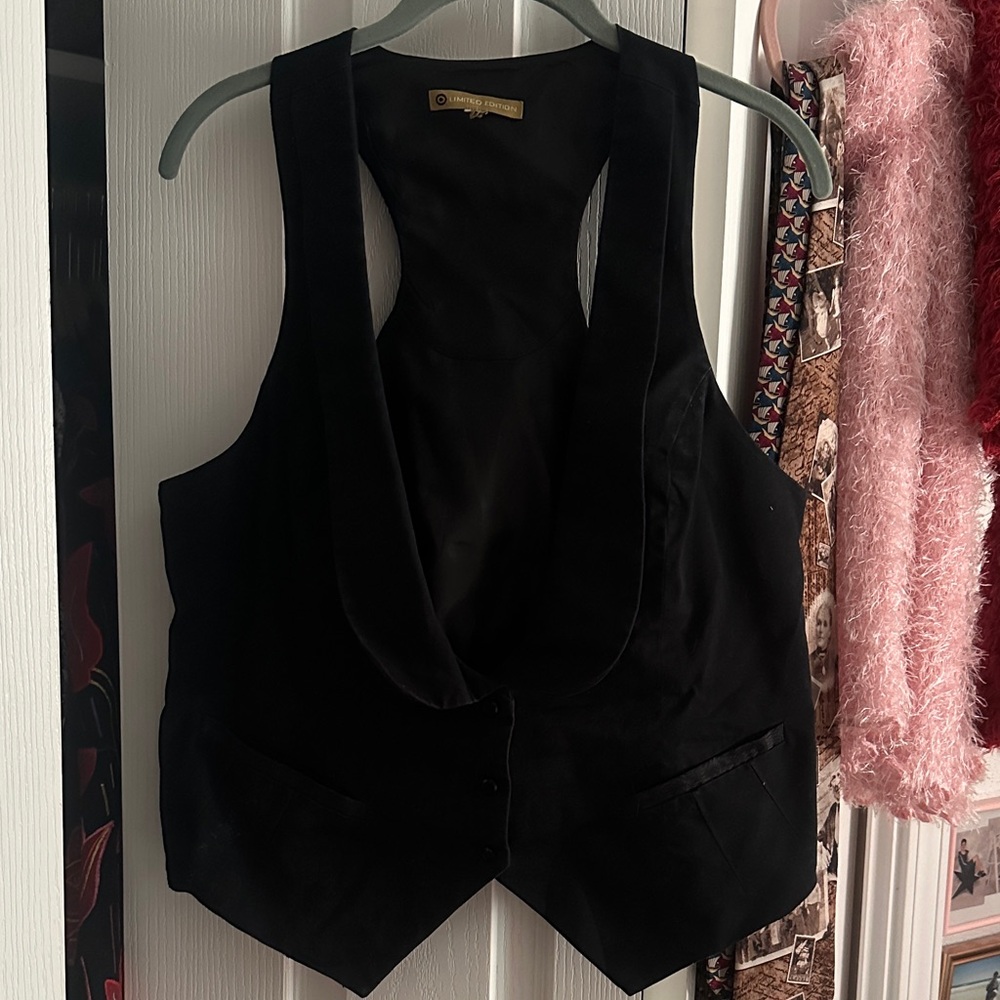 Elegant Black Sleeveless Vest by [Brand]